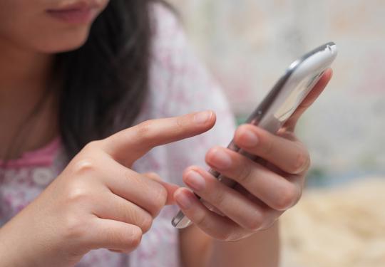 Person Using Mobile Phone