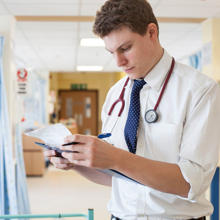 Doctor Checking Notes