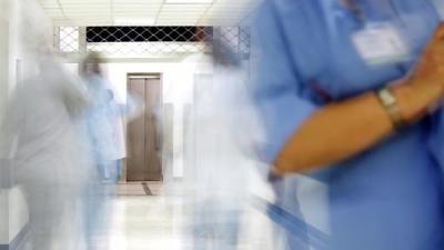 Doctor in busy hospital