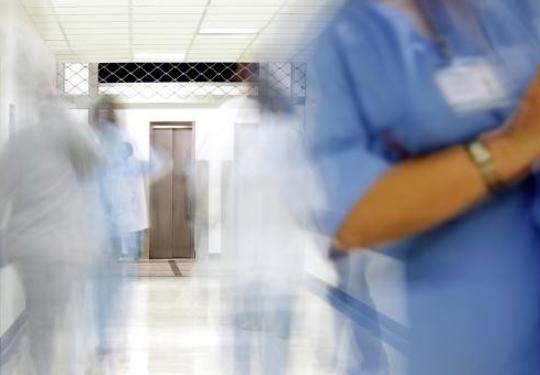 Doctor in busy hospital