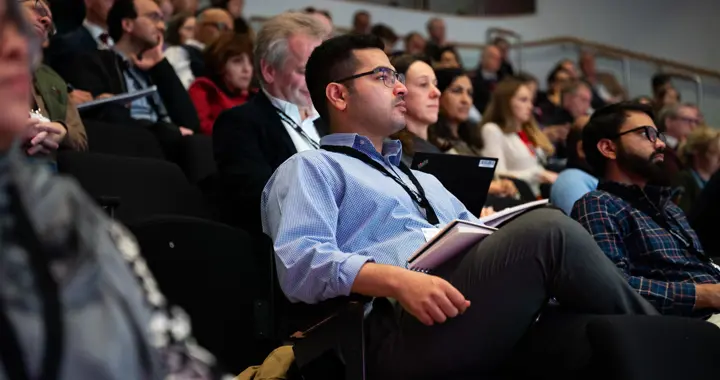 Attendees Watching Conference (1)