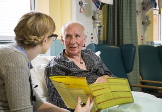 Doctor and patient in bed