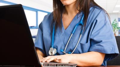 Doctor using laptop